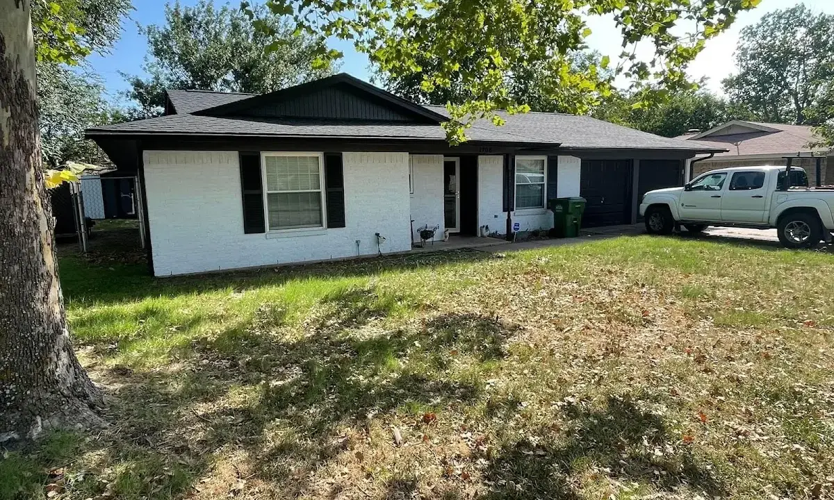 Professional roofing crew working on a residential roof in Reading